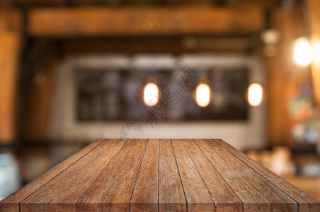 古桌面观木制桌顶上咖啡店面的木制桌模糊抽象背景背景