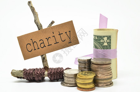 有慈善标签的硬币和钱金融概念图片