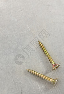 金属背景的螺丝工具金属背景纹理的螺丝工具图片