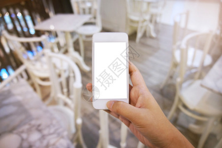 近身妇女手握机空白复制间屏幕智能电话带有技术概念图片
