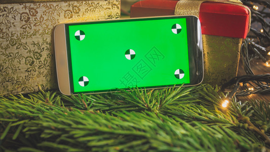 用空白绿屏幕插入文字或图片以对抗圣诞节装饰和礼品用空绿屏幕插入文字或图片以对抗圣诞节装饰和礼品图片