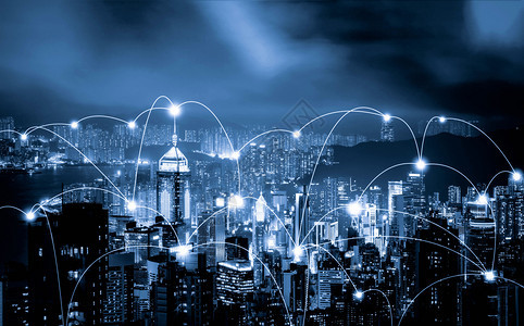 香港市中心与维多利亚港的数码网络连接线路智能城市金融区在技术概念上天桥和高楼建筑夜间空中观察图片