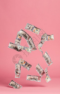 钞票在粉红色背景上下跌货币和金融经济美元钞票在粉红色背景上下跌图片