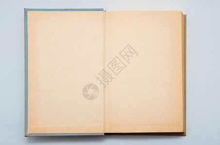 木制桌上的旧笔记本背景图片