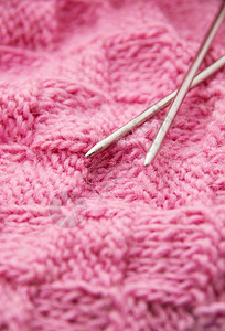 编织的手工艺针羊毛设计纹理和编织针头的详情高清图片