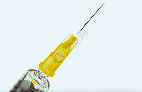 注射胰岛素典型的塑料医疗注射器配有可分解的不锈钢针头背景