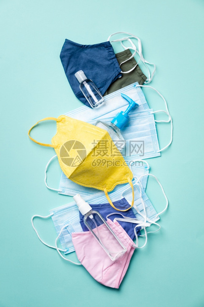 各种保护流感冠状新冠19的面罩医疗可再使用的棉面罩和蓝底手扫涤剂图片