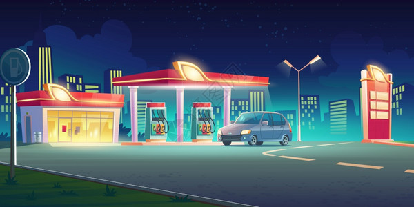 配有汽车的城镇公路加油站夜间展示高清图片