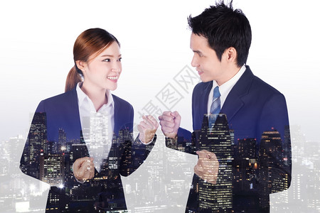 成功的男女商人接触成功的双倍商业接触手与背景一起举手来图片