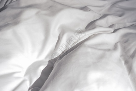 白色床单床上白色床单的细节背景图片