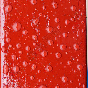 红色的雨滴油漆背景雨滴图片