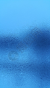 蓝色自然背景玻璃上有水滴图片
