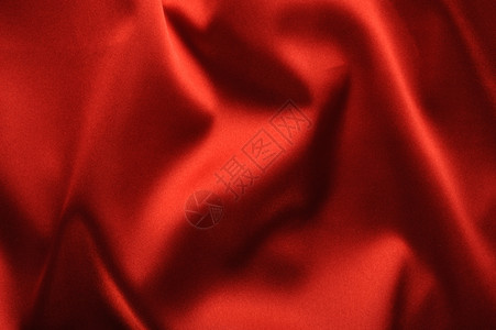 红色的沙丁鱼背景一种有美丽的光影波面织物图片