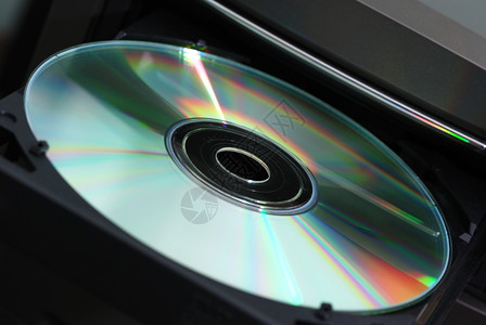 磁盘在驱动中照片关闭CD盘片背景图片