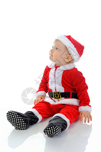 穿着圣诞老人帽子的快乐男孩孤立于白种背景图片