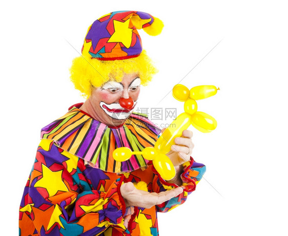 可笑的照片一个小丑看着恶心像一个气球动物粪便在他的手中图片