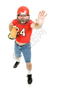 足球运动员带着一个巨大的子三明治像脚球一样全身都是白的图片