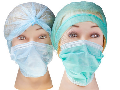 身戴纺织外科手术帽和白皮隔离的医疗保护面罩女男医生头部图片