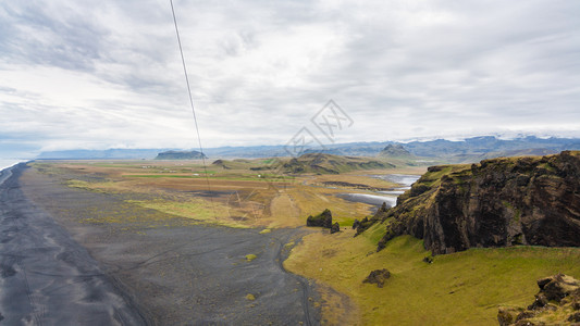 去冰岛旅游九月在卡特拉地质公园的大西洋南岸VikIMyrdal村附近的Dyrholaey海角观看索尔黑马法拉海岸图片