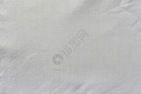白色织物表面的皱纹背景用于设计对象背景纺织品纤维的外观图片