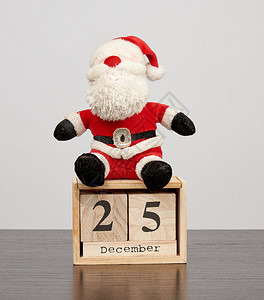 红帽子的圣丹达卡片日期为12月5日的桌木历圣诞节背景图片