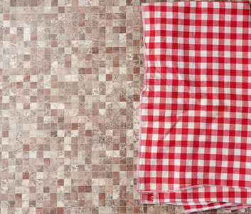 毛巾纹理褐色厨房表面顶视图复制空间上的红色检查棉花厨房毛巾背景