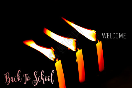燃烧的蜡烛回到学校作为教育学和习概念背景