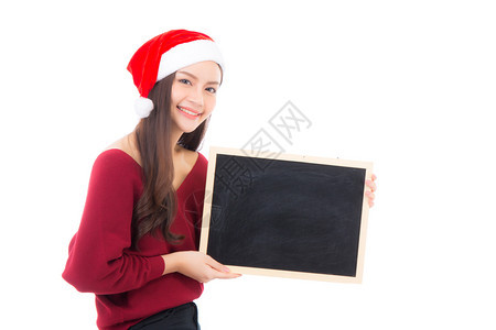 穿着圣塔帽的美丽诞节年轻女子的肖像图片