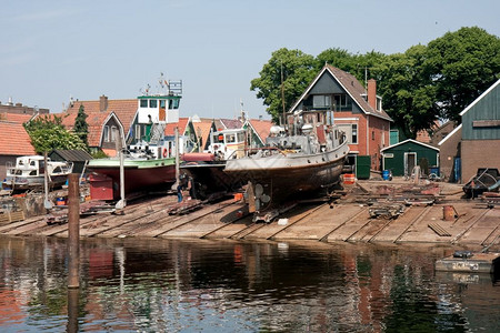 在渔业村用拖船建造的旧荷兰码头船厂图片