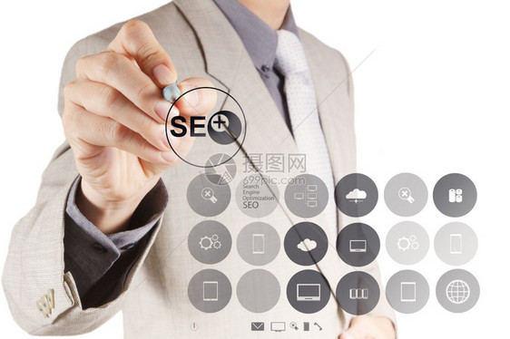 显示搜索引擎优化SEO概念的商人手图片