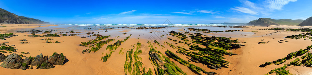 沙滩上的岩层阿尔加夫科斯塔维提纳葡萄牙图片