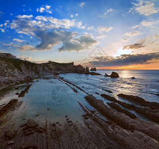 ArniaBeach西班牙大洋海岸线日落来自岩石图片