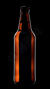 黑色的液体来自棕玻璃的啤酒瓶以黑色背景与世隔绝图片