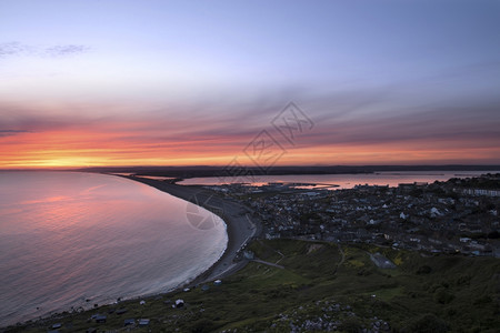 Chesil海滩日落太阳欧洲韦茅斯背景图片