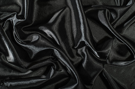 黑色西边面织物背景闪亮的丝绸背景黑暗缎丝滑图片