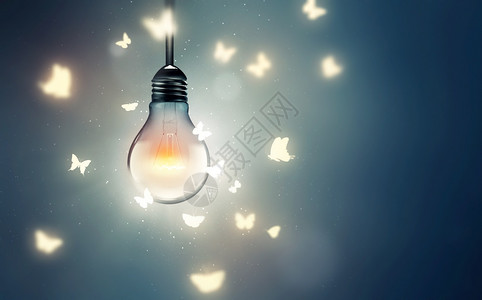 发光蝴蝶光亮的灯泡和蝴蝶在光上飞翔象征创新形的背景