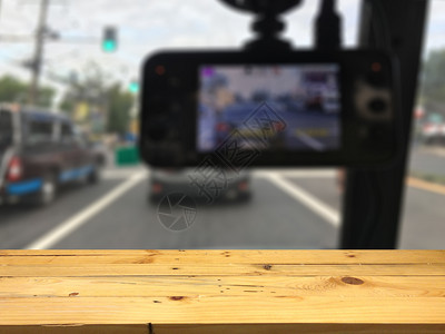 速度监视器电子产品空木制桌间平台和模糊的照相机记录器背景用于产品显示时效图片
