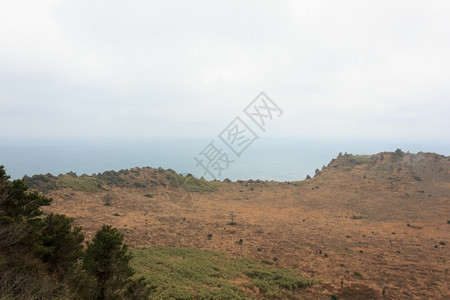 地平线景观韩国济州岛蓝海火山口自然图片