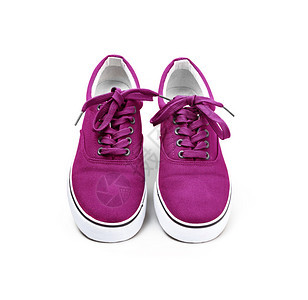 运动的时尚一双粉红色彩帆布鞋在白背景和剪切路径上被孤立粉色的图片