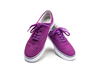 颜色新的运动一双粉红色彩帆布鞋在白背景和剪切路径上被孤立图片