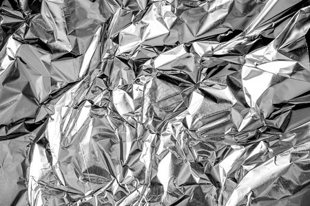 材料折叠挫败铝箔皱巴的银质感抽象背景图片