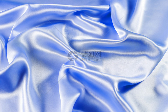 柔软的装饰缎闪亮蓝织物波浪图片
