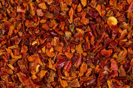 粉碎红辣椒用于背景纹理薄片种子粉末图片