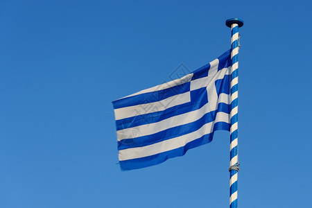 希腊的在蓝天背景下挥舞希腊旅行手横幅图片
