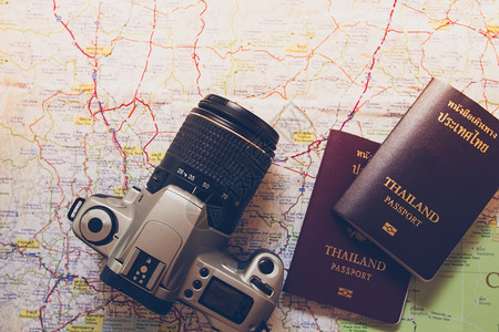 项目国际的航班泰护照和世界旅行上的泰国护照和相机Asia图片