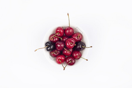 甜点白樱桃上隔绝的碗红熟樱桃关闭夏季莓樱桃关闭夏季浆果团体素食主义者图片