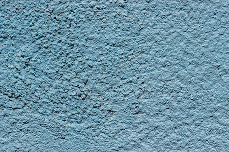 以蓝漆为背景或纹理的混凝土墙碎片化质地不均匀的石膏图片