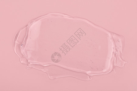 面部的脸水在粉红背景上隔离的清液凝胶涂片身体和面部护理疗养院化妆品概念血清质素粉红色背景上隔离的清洁凝胶涂片图片