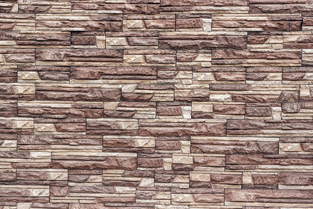 抽象的以几何形态作为背景或纹理的棕色调状土石砖岩壁装饰墙建造质地图片