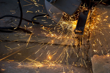 手动工具建造速度电的从金属工业概念中精美地看待磨碎的火花背景